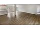 Bright, open-concept living room featuring modern flooring, ample natural light, and a kitchen island at 510 Newport Dr, Salisbury, NC 28144