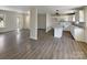 Open-concept living space with luxury vinyl flooring, blending seamlessly into the modern kitchen with an island at 510 Newport Dr, Salisbury, NC 28144
