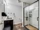 Bathroom featuring dark vanity, and a luxurious glass shower with white tile surround at 5247 Crystal Lakes Dr, Rock Hill, SC 29732