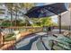Outdoor deck featuring comfortable seating, lake views, grill, and shaded umbrella at 532 Dalkeith Ave, Rock Hill, SC 29732