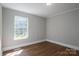 Bedroom with wood floor and natural light at 570 N Rhyne St, Gastonia, NC 28054