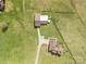 Aerial view of two properties and acreage separated by a long driveway and fencing at 6808 Austin Grove Church Rd, Marshville, NC 28103