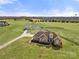 Expansive aerial view of the property, showcasing the home, surrounding land, and outbuildings at 6808 Austin Grove Church Rd, Marshville, NC 28103