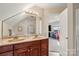 Bright bathroom with a double sink vanity, modern fixtures, and an attached bonus room at 6808 Austin Grove Church Rd, Marshville, NC 28103