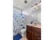 ' bathroom features a shark-themed shower curtain and ample lighting at 6808 Austin Grove Church Rd, Marshville, NC 28103