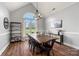 Bright dining room features wood floors, large arched window, and stylish chandelier at 6808 Austin Grove Church Rd, Marshville, NC 28103