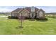 Beautiful brick home with a well-manicured lawn and lovely landscaping details at 6808 Austin Grove Church Rd, Marshville, NC 28103