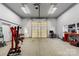 Garage features a high ceiling, ample lighting, and work space at 6808 Austin Grove Church Rd, Marshville, NC 28103