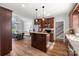 Open kitchen featuring granite countertops, a central island, and stainless steel appliances at 6808 Austin Grove Church Rd, Marshville, NC 28103