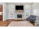 Bright living room with fireplace and adjacent doorway to another room at 6808 Austin Grove Church Rd, Marshville, NC 28103