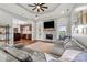Inviting living room with stone fireplace, hardwood floors, and an open layout to the kitchen at 6808 Austin Grove Church Rd, Marshville, NC 28103