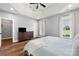 Airy primary bedroom with wooden floors, trey ceilings and neutral walls at 6808 Austin Grove Church Rd, Marshville, NC 28103