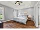 Spacious main bedroom features tray ceilings, wood floors, and large windows at 6808 Austin Grove Church Rd, Marshville, NC 28103