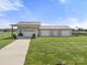 Outbuilding/Garage with multiple garage doors and an extra carport at 6808 Austin Grove Church Rd, Marshville, NC 28103