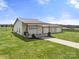 Outbuilding featuring three garage doors with covered area and lots of acreage at 6808 Austin Grove Church Rd, Marshville, NC 28103