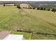 Aerial view of a well maintained pasture, fenced and ready for livestock grazing at 6808 Austin Grove Church Rd, Marshville, NC 28103