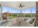 Screened patio featuring stylish seating, coffee table and view of the farm land at 6808 Austin Grove Church Rd, Marshville, NC 28103