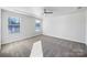 Light-filled bedroom with neutral walls, ceiling fan, and plush carpeting at 7120 Saltpeter St, Charlotte, NC 28215