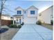 Charming two-story home with a well-maintained lawn and a classic architectural design at 7120 Saltpeter St, Charlotte, NC 28215