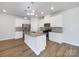Well-equipped kitchen features stainless steel appliances and a granite-topped island at 7120 Saltpeter St, Charlotte, NC 28215