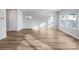 Bright, open living room with modern wood-look floors and abundant natural light at 7120 Saltpeter St, Charlotte, NC 28215