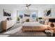 Inviting main bedroom with large windows, ceiling fan, and neutral decor at 7120 Saltpeter St, Charlotte, NC 28215