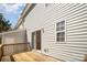 Back deck with wood flooring, sliding doors to the interior, and a view of the backyard at 7361 Sun Dance Dr, Fort Mill, SC 29707