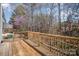 Wooden deck provides a tranquil view of the surrounding trees and nature at 7361 Sun Dance Dr, Fort Mill, SC 29707