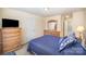 Comfortable bedroom with an ensuite bathroom, dresser, and bright natural light at 7361 Sun Dance Dr, Fort Mill, SC 29707