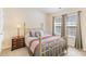 Comfortable bedroom with carpeted floors, neutral walls, and a brass-colored metal bedframe at 7361 Sun Dance Dr, Fort Mill, SC 29707