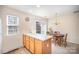 Cozy dining area features a chandelier, sliding glass doors to the outside deck and neutral carpeting at 7361 Sun Dance Dr, Fort Mill, SC 29707