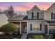 Charming townhome exterior showcasing brick and siding, enhanced by a landscaped front yard and inviting entrance at 7361 Sun Dance Dr, Fort Mill, SC 29707