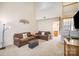Bright and spacious living room with high ceilings, neutral carpet, and access to the staircase at 7361 Sun Dance Dr, Fort Mill, SC 29707
