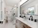 Modern bathroom with double vanity, marble countertops, glass shower, and stylish fixtures at 7801 Snowden Ln, Charlotte, NC 28270