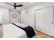 Bright bedroom featuring a comfortable bed with stylish decor and large closet doors at 7801 Snowden Ln, Charlotte, NC 28270