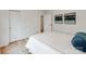Light and airy bedroom with fresh white linens, minimalist artwork, and double closets at 7801 Snowden Ln, Charlotte, NC 28270