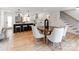 Modern open floor plan with kitchen island and adjacent dining area at 7801 Snowden Ln, Charlotte, NC 28270