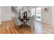 Dining room with hardwood floors, natural light, and modern table at 7801 Snowden Ln, Charlotte, NC 28270