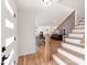 Inviting entryway with wooden staircase leading to open-concept living space at 7801 Snowden Ln, Charlotte, NC 28270
