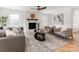 Inviting living room with fireplace, natural light, and stylish furnishings at 7801 Snowden Ln, Charlotte, NC 28270