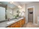 Bathroom with double sinks, granite countertops, modern fixtures, and lots of storage at 7806 Spanish Oaks Dr, Waxhaw, NC 28173