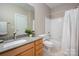Well-lit bathroom featuring a vanity with solid surface countertop, a tub, and neutral-toned walls at 7806 Spanish Oaks Dr, Waxhaw, NC 28173