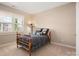 Comfortable bedroom with neutral tones, window, and classic-style bed frame at 7806 Spanish Oaks Dr, Waxhaw, NC 28173