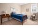 Bright bedroom with a comfortable bed, desk, and rocking chair, offering a peaceful retreat at 7806 Spanish Oaks Dr, Waxhaw, NC 28173