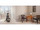 Versatile bonus room with space for a stationary bike and cozy seating area for relaxation at 7806 Spanish Oaks Dr, Waxhaw, NC 28173