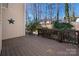 Spacious wooden deck with railing, offering outdoor living space with a view of the surrounding yard at 7806 Spanish Oaks Dr, Waxhaw, NC 28173