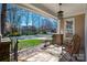 Cozy covered front porch with seating area offering a view of the neighborhood at 7806 Spanish Oaks Dr, Waxhaw, NC 28173