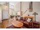 Spacious living room with hardwood floors, high ceilings, and an open floor plan at 7806 Spanish Oaks Dr, Waxhaw, NC 28173
