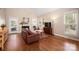Comfortable living room with hardwood floors, fireplace, and plenty of natural light at 7806 Spanish Oaks Dr, Waxhaw, NC 28173