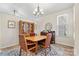 Dining room featuring furniture and decor, neutral paint, a window, and wood floors at 8402 Albury Walk Ln, Charlotte, NC 28277